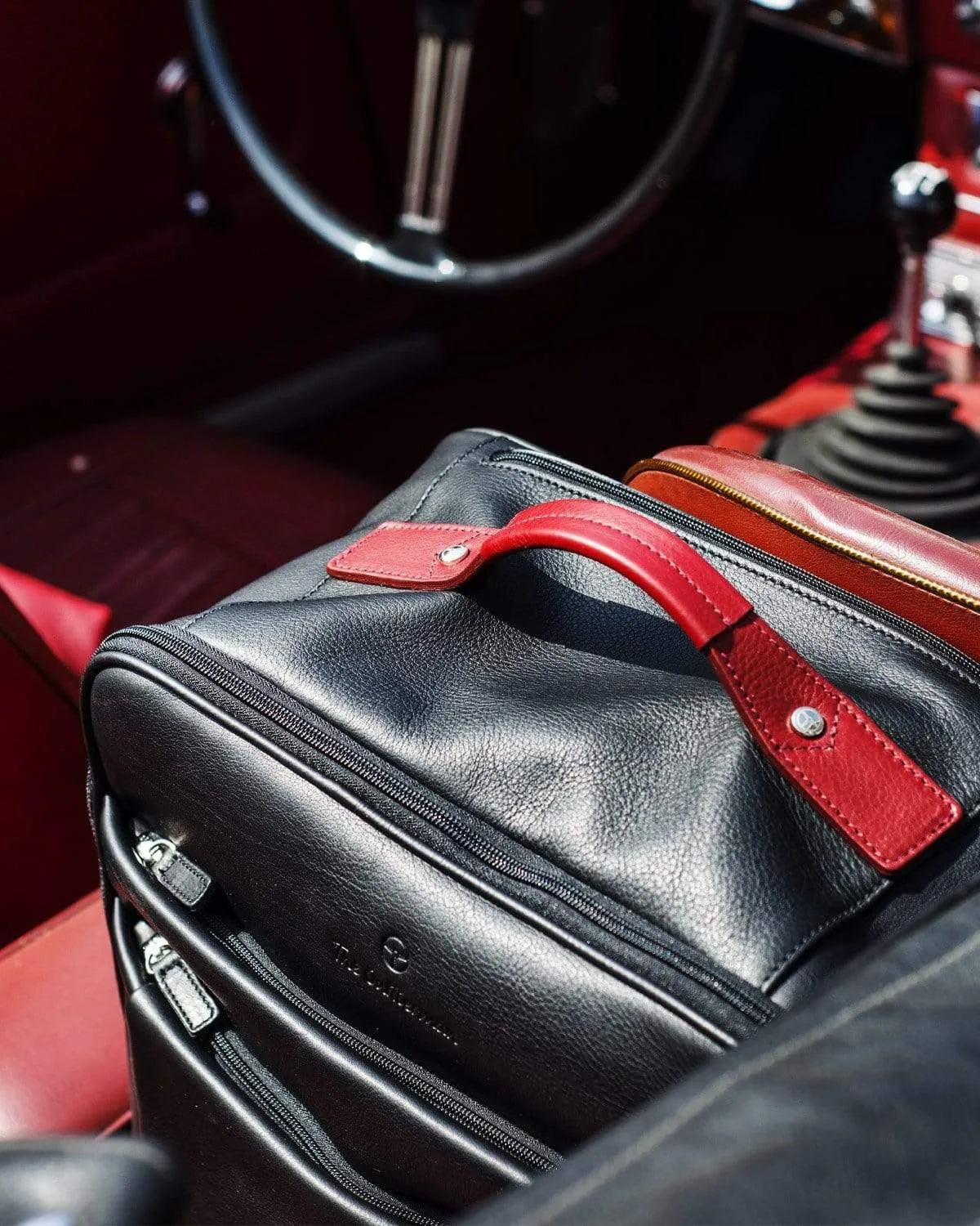 GLOBETROTTER - Full-grain Leather Trolley Bag - Black/Red